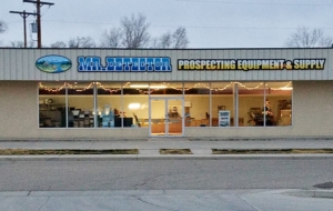 Mr. Detector storefront on Ute Street in Delta, Colorado, lit up in the evening